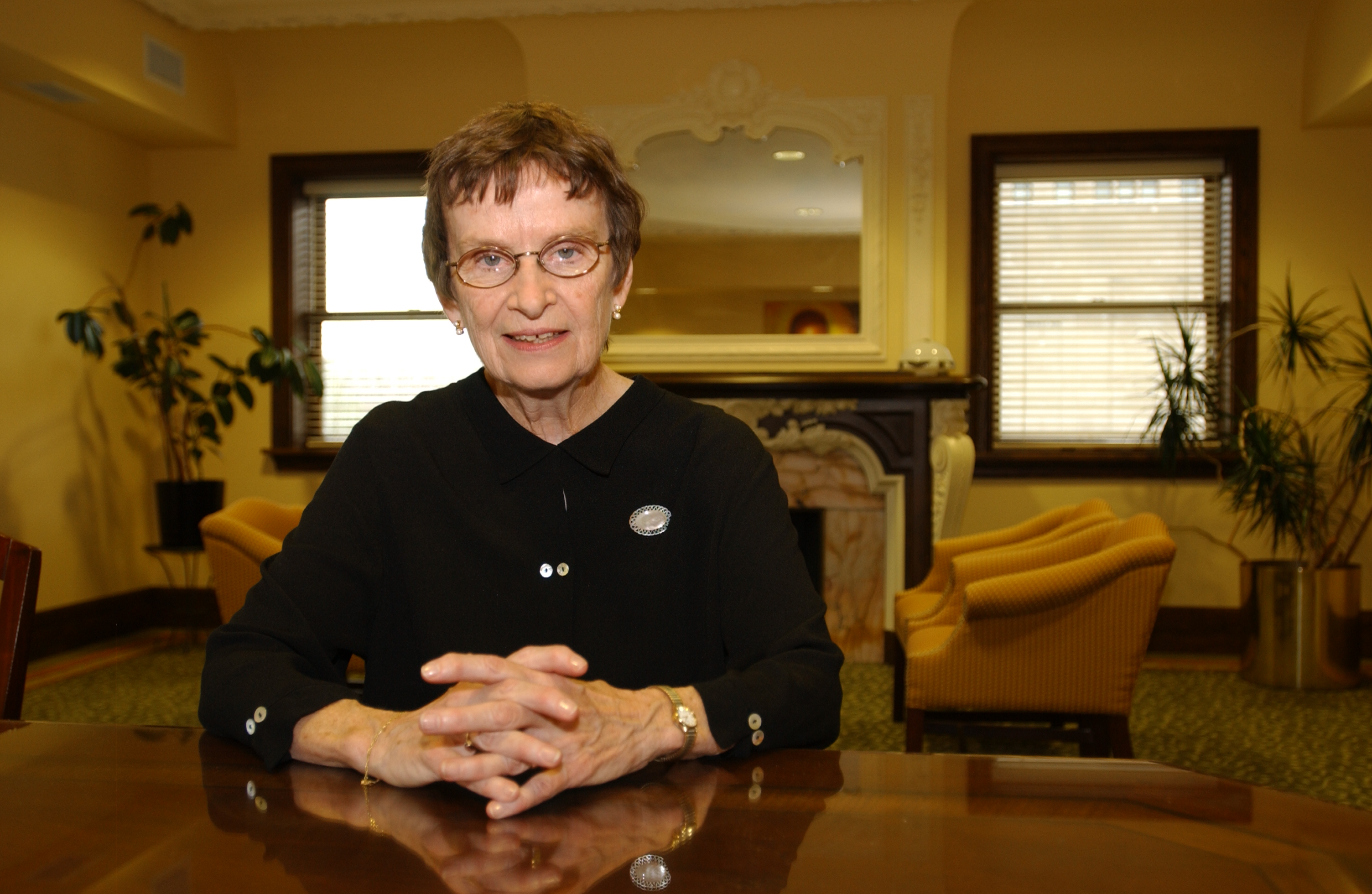 Farrell, BVM sitting at table in Gannon Center